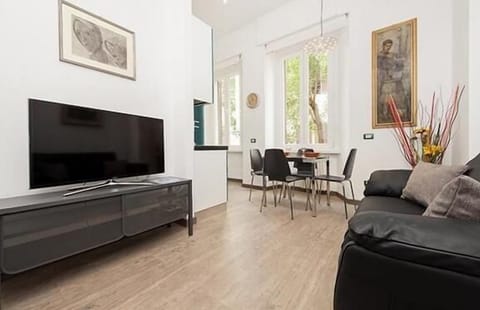 living room kitchen with a second TV