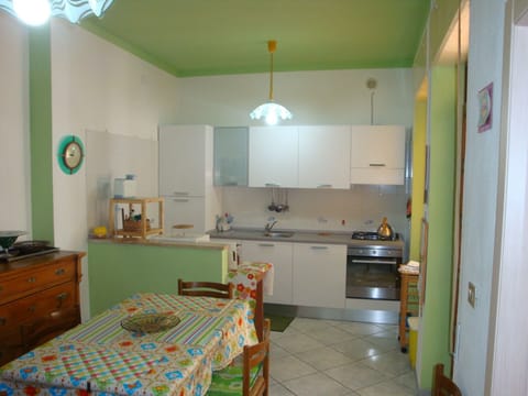 Part of the eating area and the connected kitchenette.