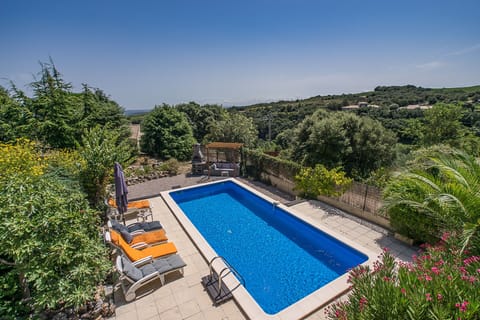 Loungers around the pool - view of vineyards to the coastline
