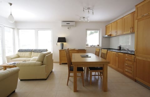Living area & kitchen through to front balcony