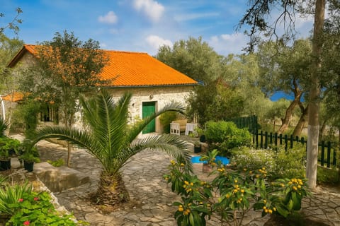Peaceful stone cottage surrounded by lush Mediterranean nature