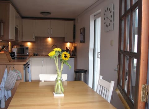 The kitchen and dining area taken through the stable doorway