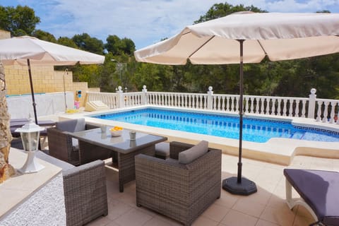 Private pool with lounge set and sunbeds