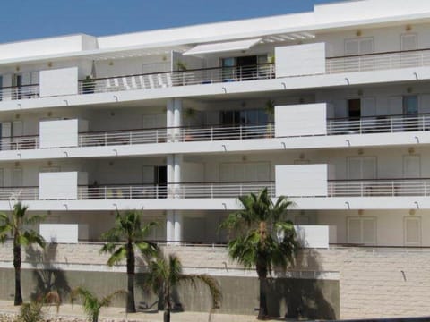 View to apartment, top floor centre, balcony with sun awning