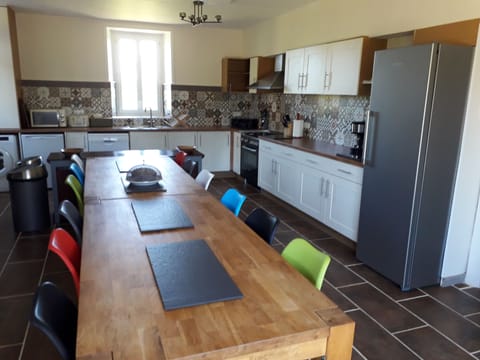 Kitchen and dining area. Table set for 14