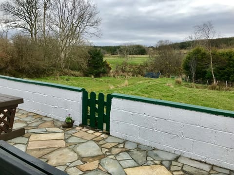 The cottage paddock bordered by a stream
