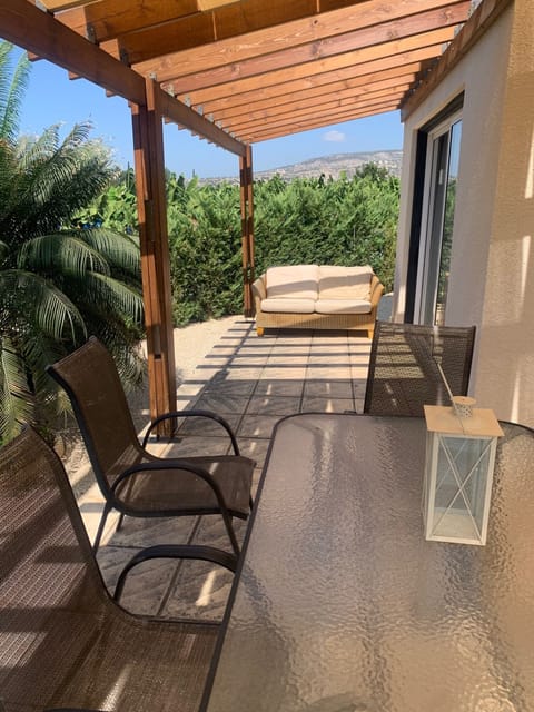 large terrace with settee and dining
