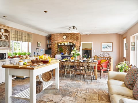 Large kitchen with Aga, two pyrolytic electric ovens, a gas hob and wine fridge