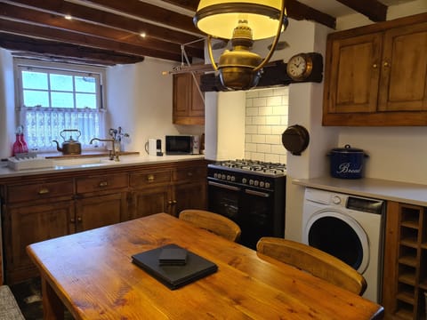  Range style dual fuel cooker, microwave,  and washer/dryer 