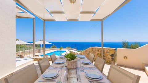Outdoor dining area with panoramic sea view!