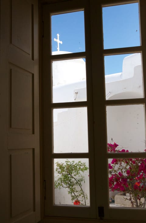 Bedroom 2 view to terrace and church rooftops