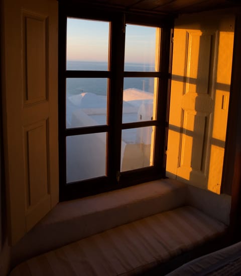 Sunset looking out across the sea towards Mykonos from upper living room