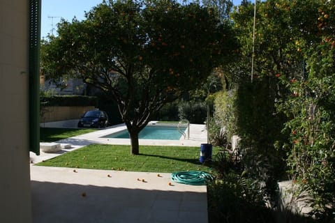 Pool view from side of house