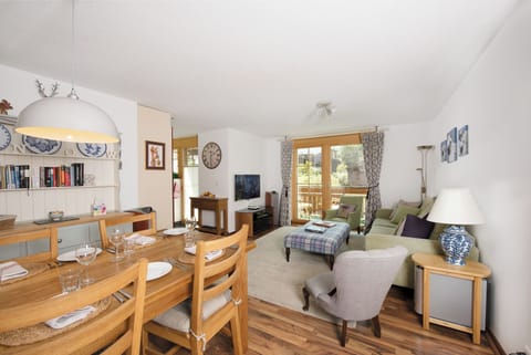 The open plan living/dining room with 45" home cinema system
