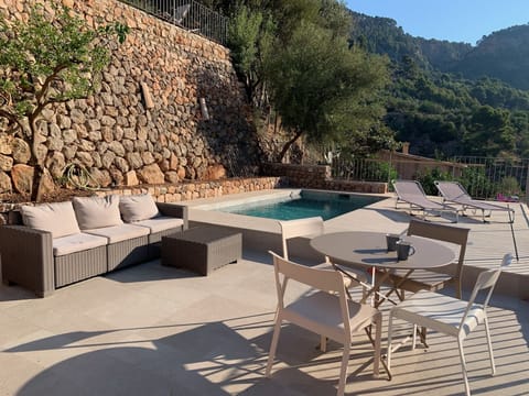 View of terrace & pool from the house.