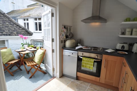 Kitchen opens on to sunny terrace
