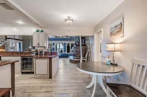 From view foyer past dining and kitchen nook out to Gulf and pool!