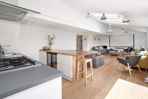 cinema lounge showing bar, drinks fridge, kitchenette