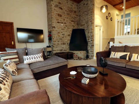 The lounge towards the open fire place