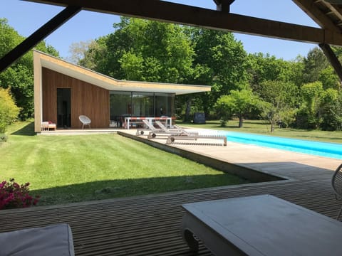 View of house and pool from covered terrase