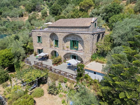 Facade with sea view terrace and garden
