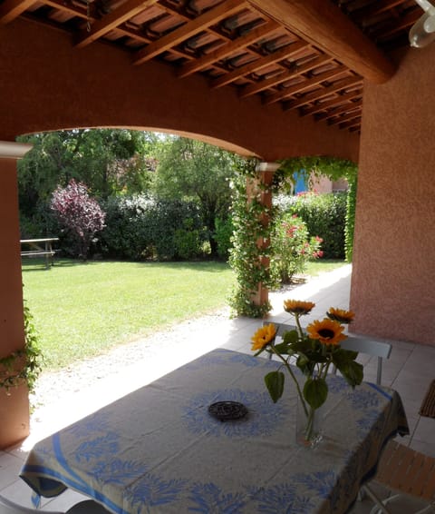 Shaded terrace looking out to front garden