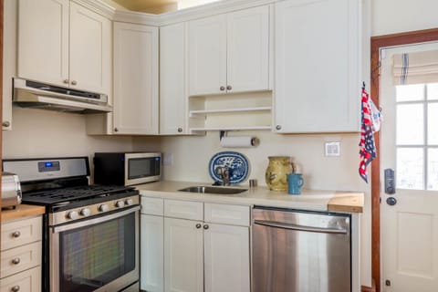Kitchen with Stainless Steel Appliances and Plasma TV