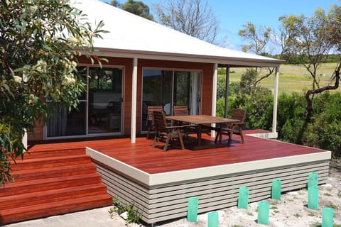 Outdoor deck area with outdoor setting with views into Innes National Park