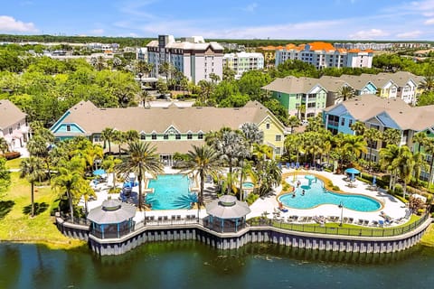 2 Pools, Clubhouse & Colorful Villas Surround Lagoon. 3 more pools across street