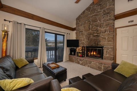 Relax by the warmth of the wood burning fireplace
