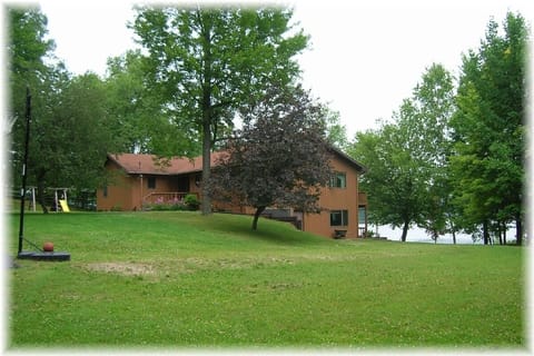 Private setting on 3 acres with 200 ft of lake frontage.