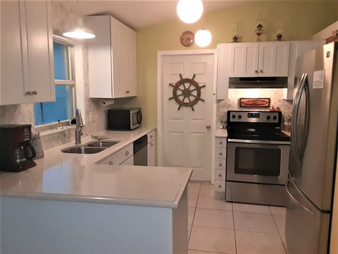 Great kitchen, fully stocked waiting for your culinary masterpieces. Marble back