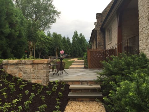 Side Terrace with Bistro Table and path that leads to apartment
