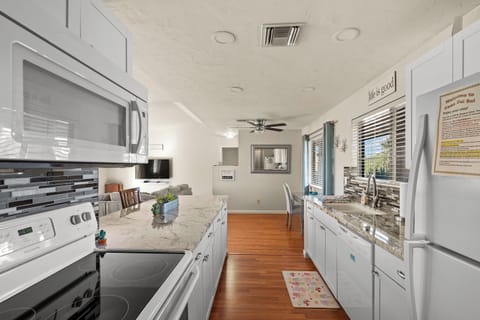 Electric range, microwave, refrigerator w/ice maker and dishwasher