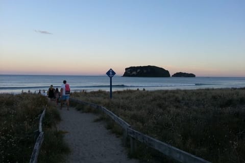 Beach access #6, 250m down the adjacent walkway.