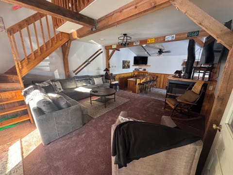 This cozy but bright living room has a gas fireplace and TV