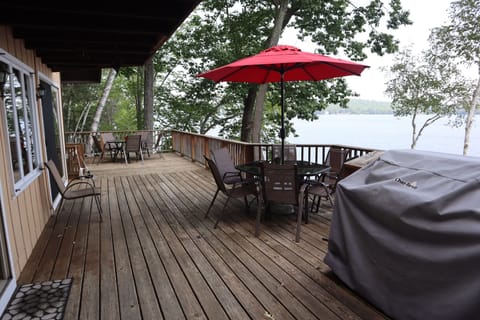 Main house large deck off main level overlooking lake, dock, and extended deck 