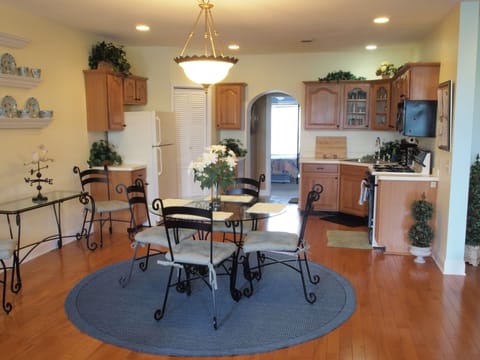 View of dining area. 6 chairs total. 2 off to side.