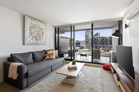 Lounge Area leading to a large balcony overlooking Docklands