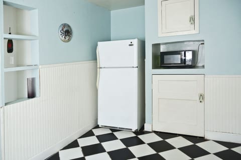 Kitchen has microwave and handy extra storage.