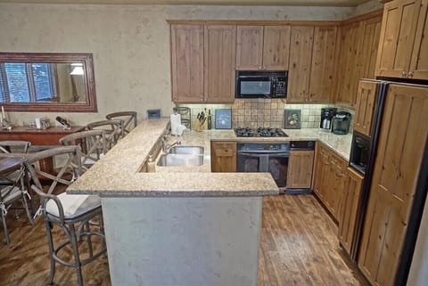Gas range and custom fridge in the Kitchen