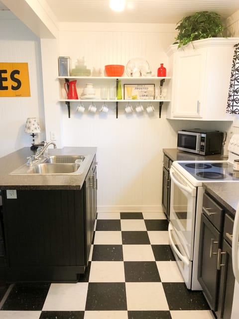 Kitchen with bar and 3 barstools