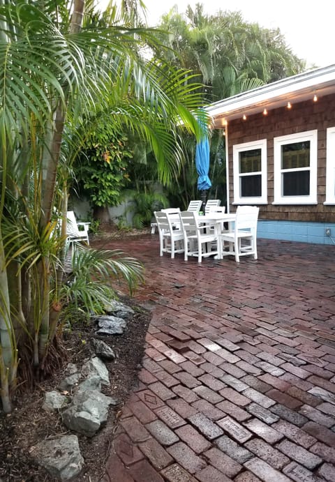 Patio area with outdoor lounging & dining areas. Solo stove fire pit and BBQ.
