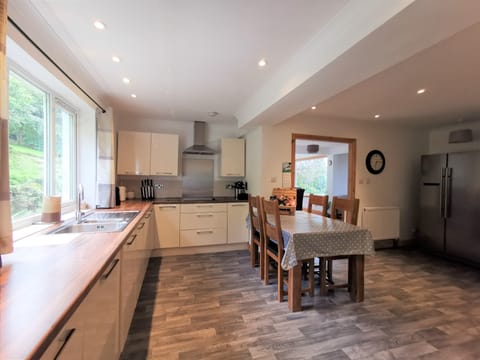 Very large kitchen with lots of cupboard space and large fridge/freezer.