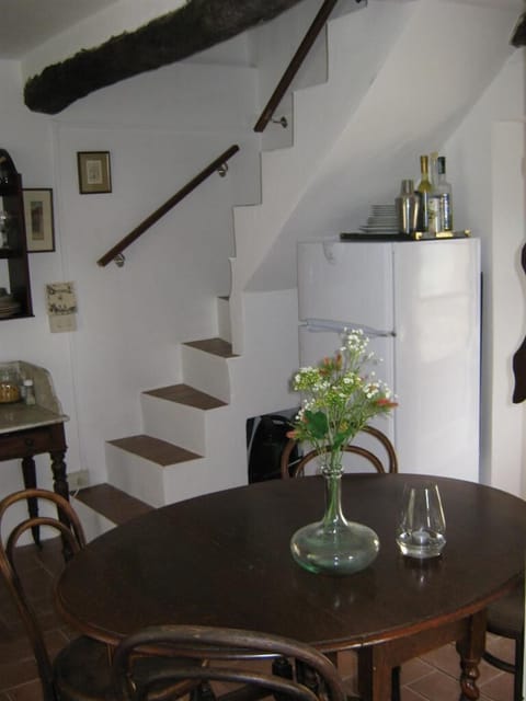 dining table and stairs to bedrooms