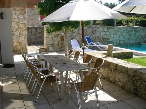 Seating for ten by the pool