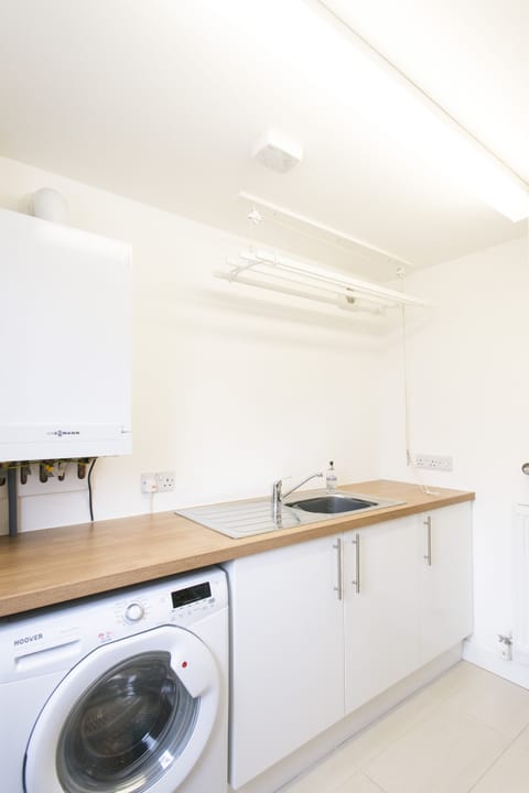 Utility with washing machine/dryer, sink, clothes airer and WC