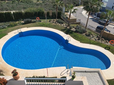 Pool area looking down from apartment terrace