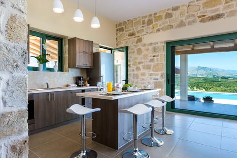 The kitchen is connected to the barbecue area