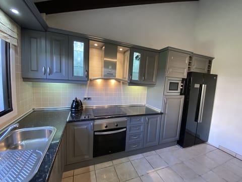 Fully fitted including American fridge/freezer.. Induction hob and oven.